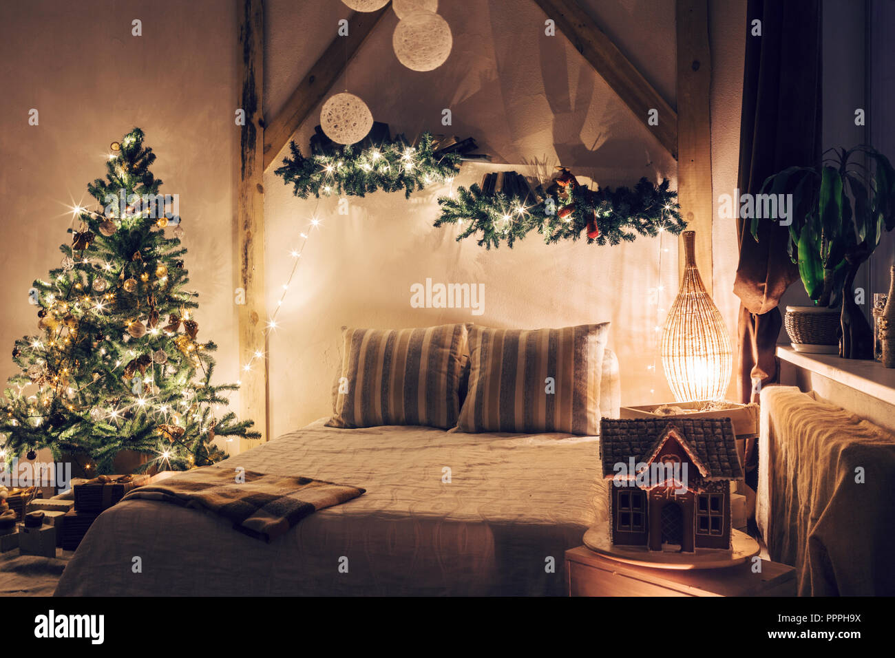 https://c8.alamy.com/comp/PPPH9X/warm-and-cozy-evening-in-living-room-sofa-bed-in-christmas-interior-concept-the-new-year-and-holidays-PPPH9X.jpg