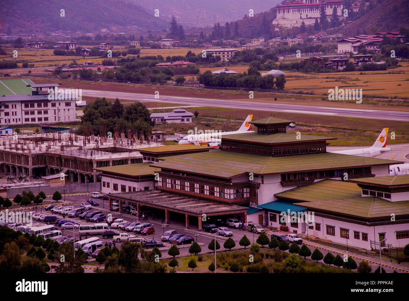 Paro Airport view Bhutan Planes perked amongst Paddy Fields low Hills 