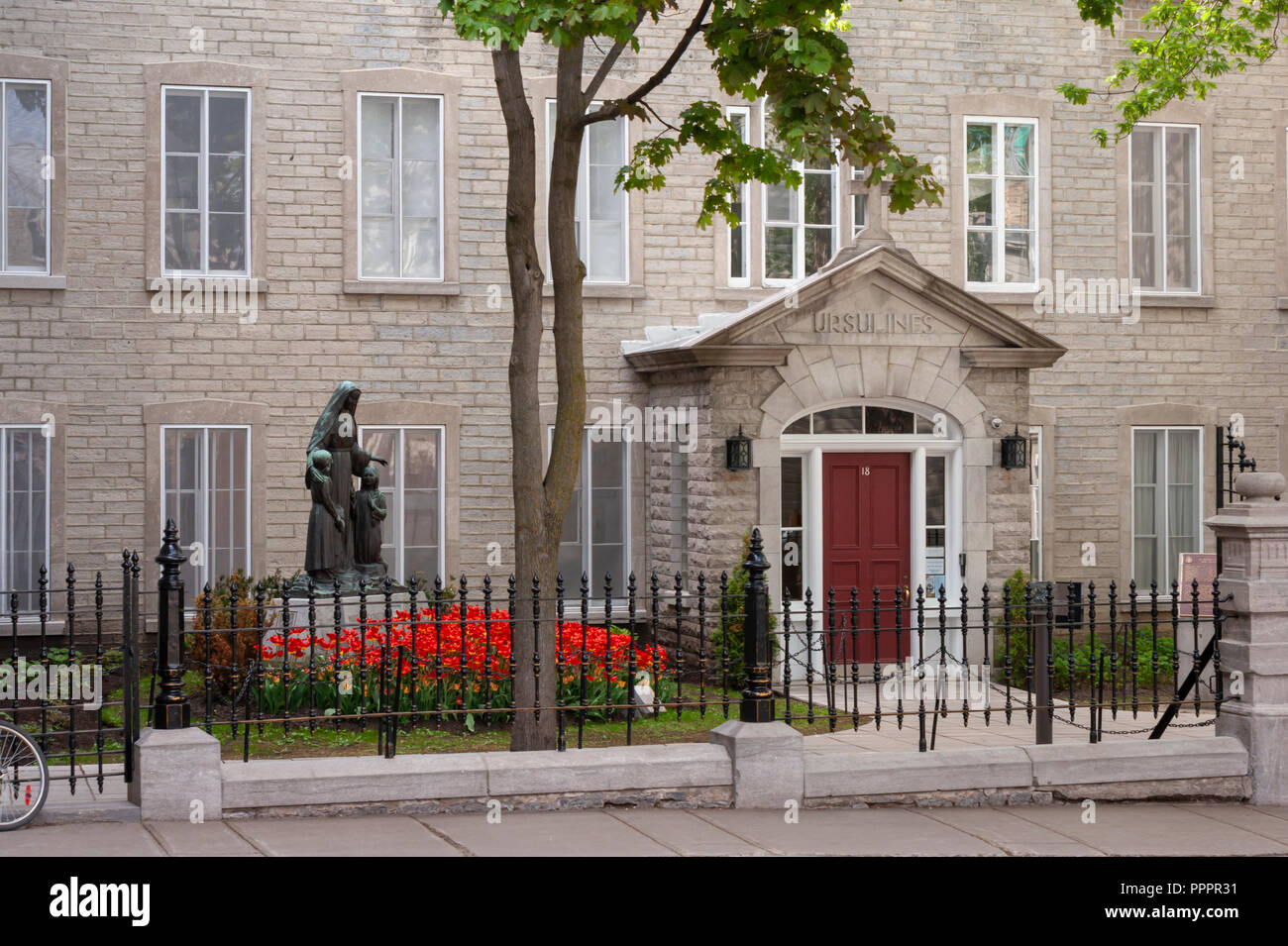 The statue of the Saint Marie of the Incarnation, the foundress of the Ursuline Order in Canada, in front of the Ursulines School in Quebec City. Stock Photo