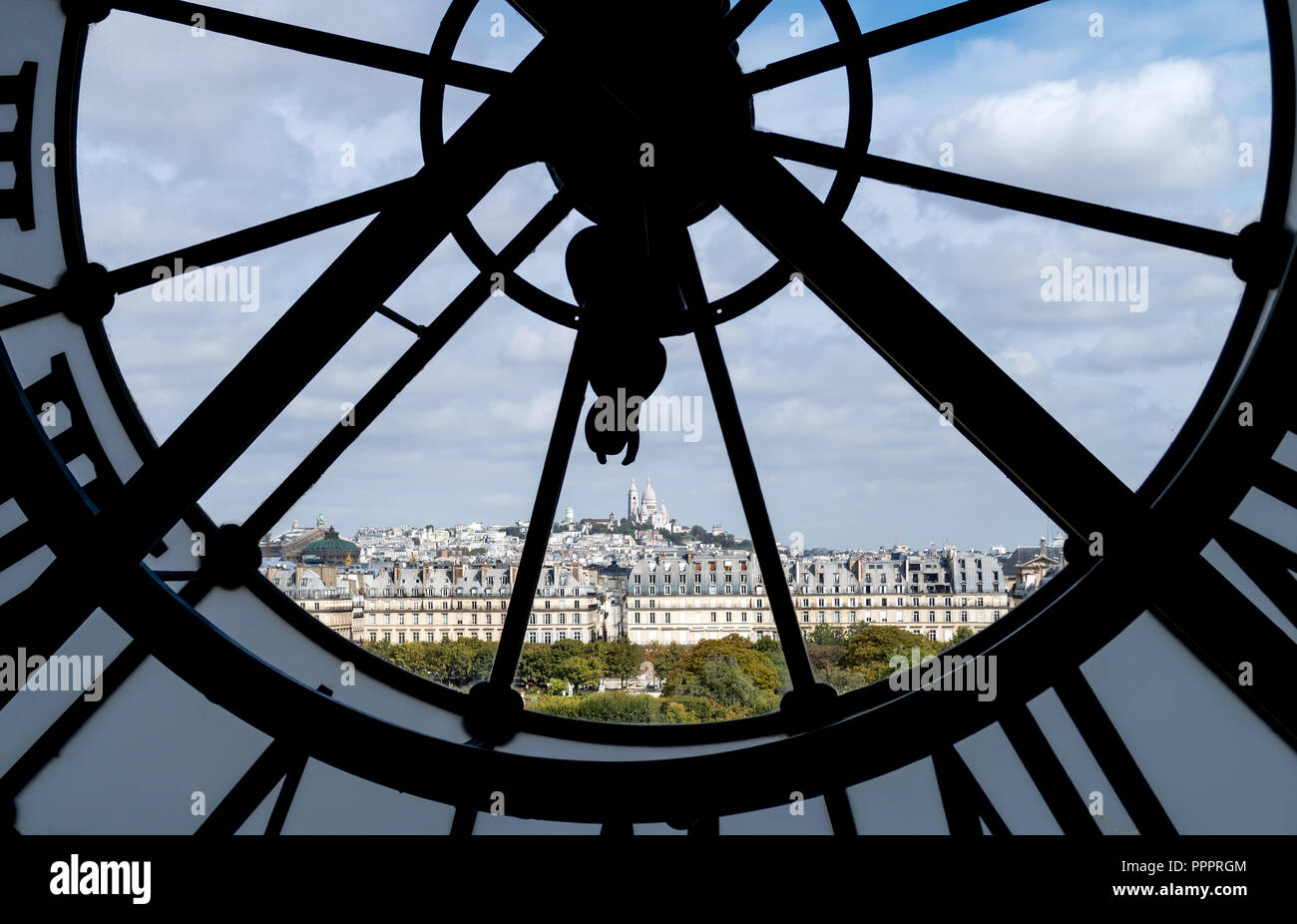 Paris cityscape through the giant glass clock at the Musee d'Orsay Stock Photo