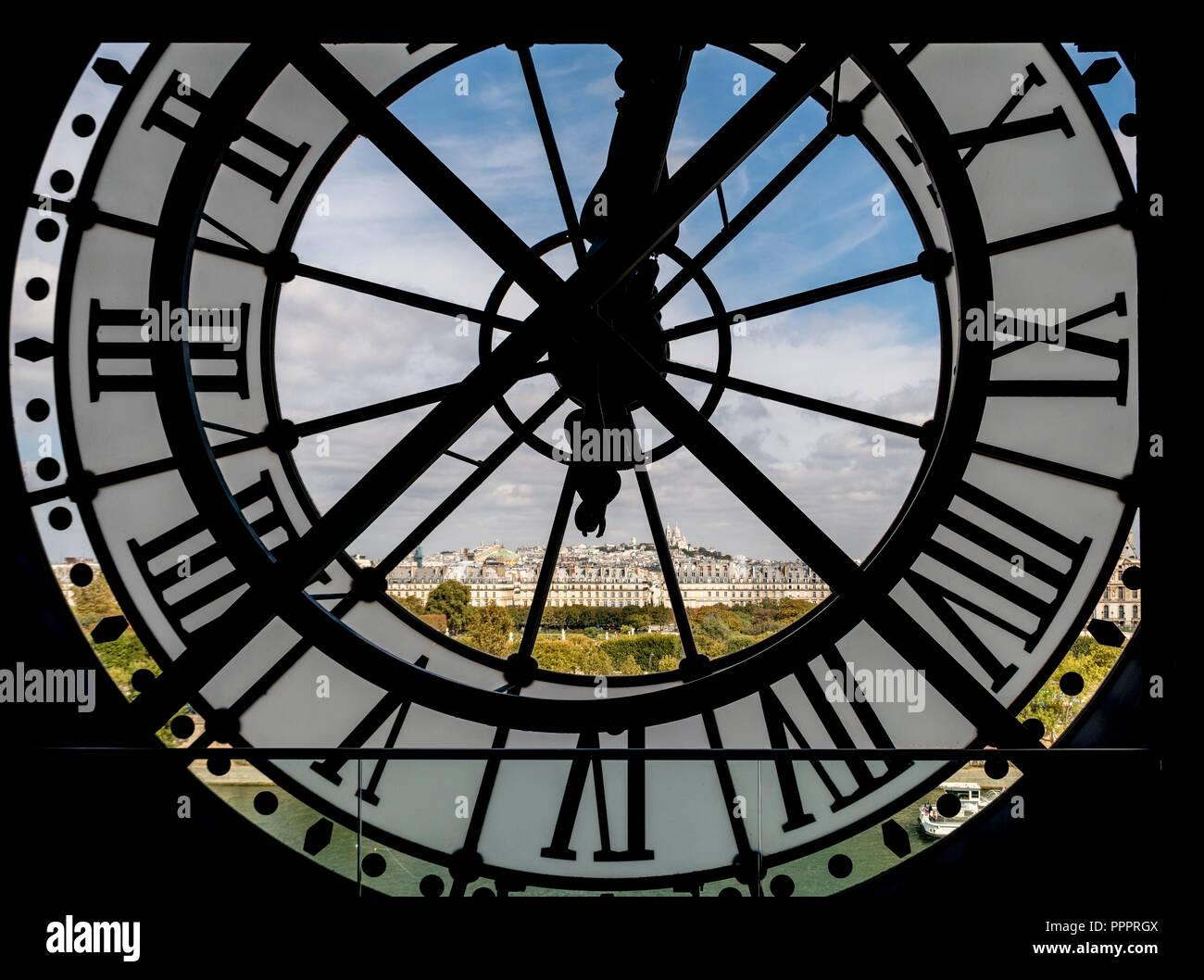 Paris cityscape through the giant clock at the Musee d'Orsay Stock Photo