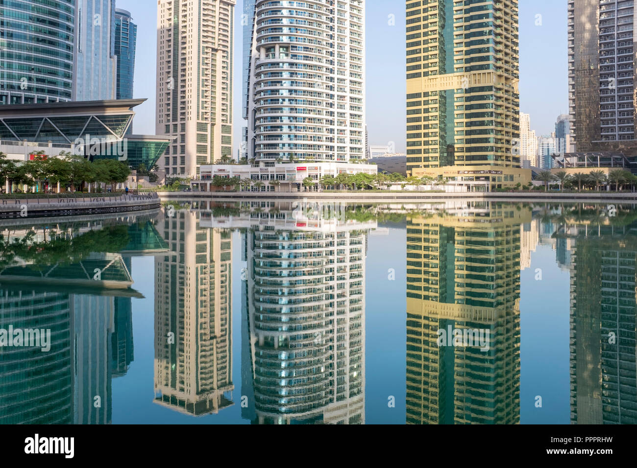 Residential and hotel towers reflected in a manmade lake in Jumeirah