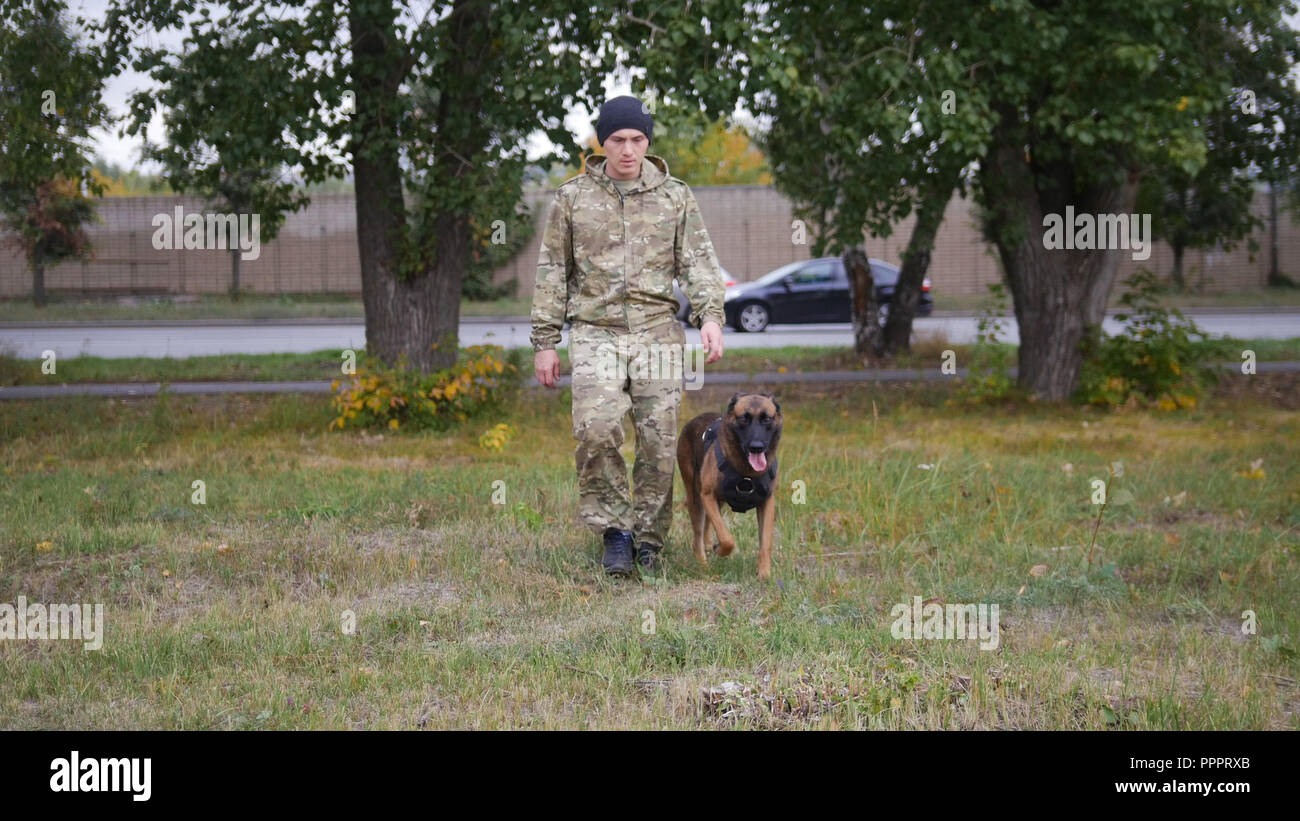 A trainer and his german shepherd dog Stock Photo