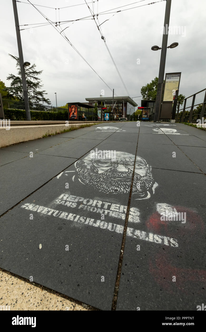 Graffiti template sprayed onto the pavement protests the rights of Turkish journalists. ECHR, Strasbourg, France Stock Photo