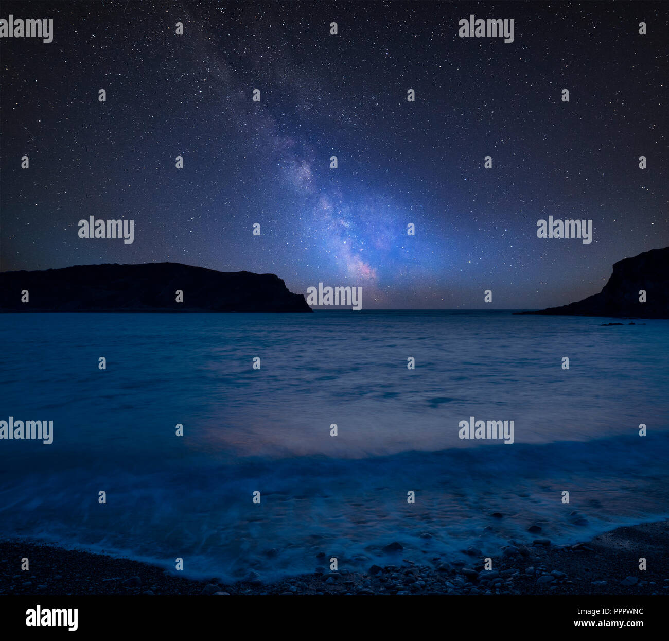 Stunning vibrant Milky Way composite image over landscape of Lulworth ...