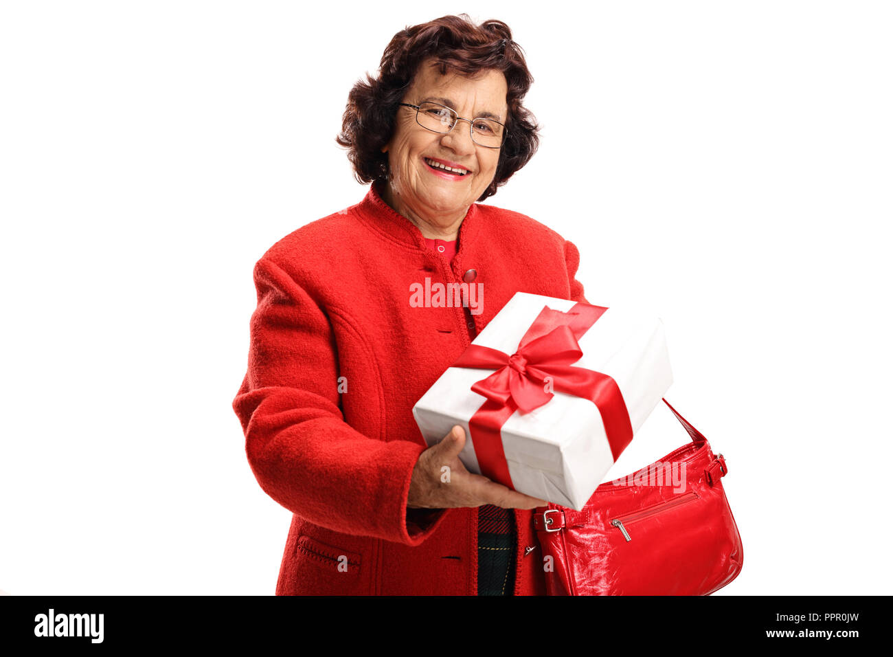 Elderly woman holding a gift in a box isolated on white background Stock Photo
