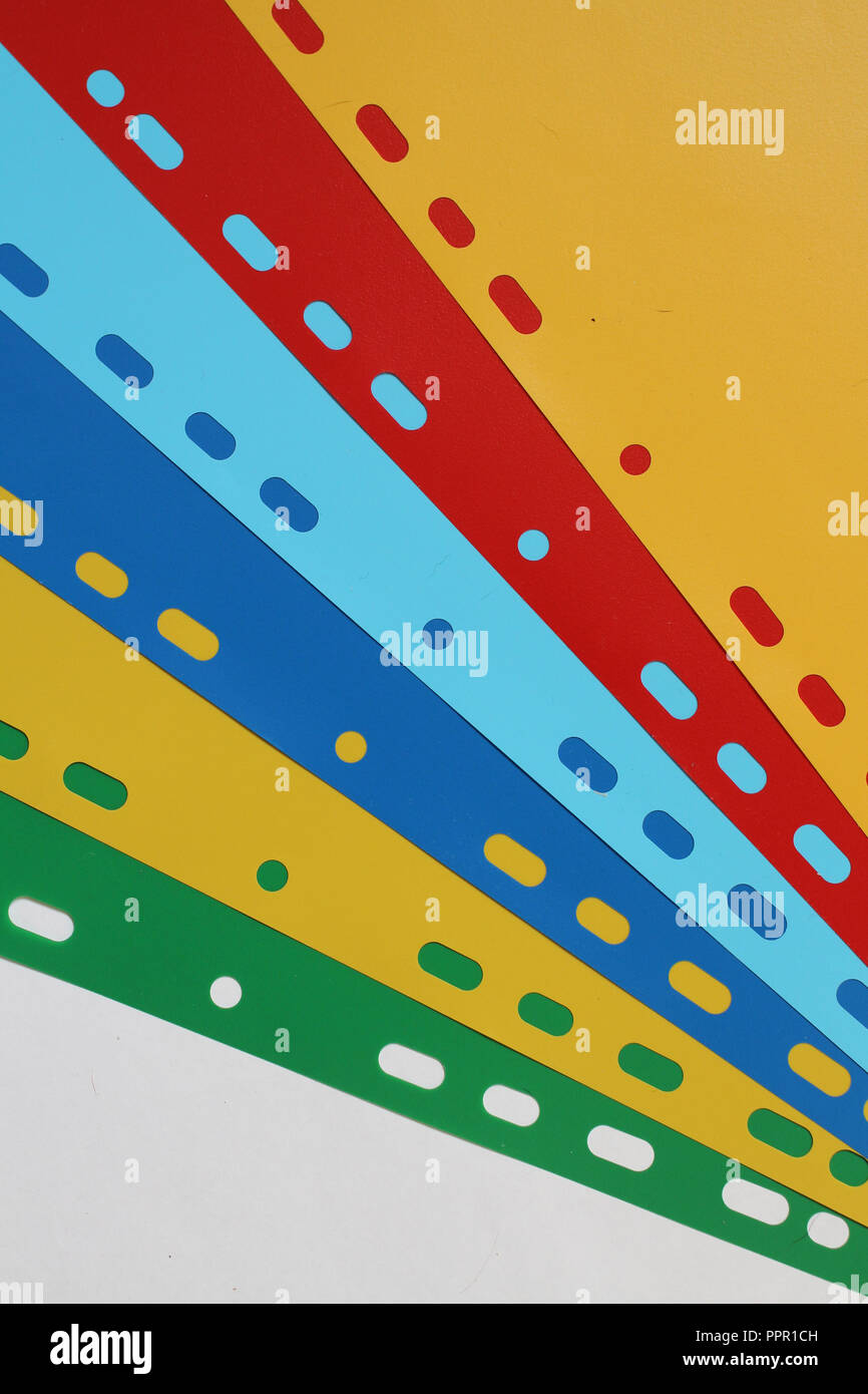 Abstract geometric background from colored sheet separators, sheets of paper, cardboard. Stock Photo