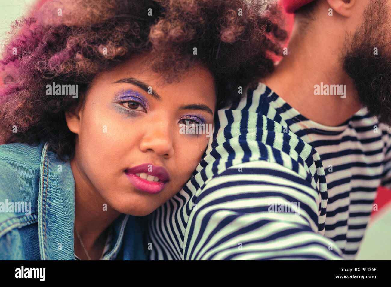 Beautiful girl having bad makeup after having big party at night Stock Photo
