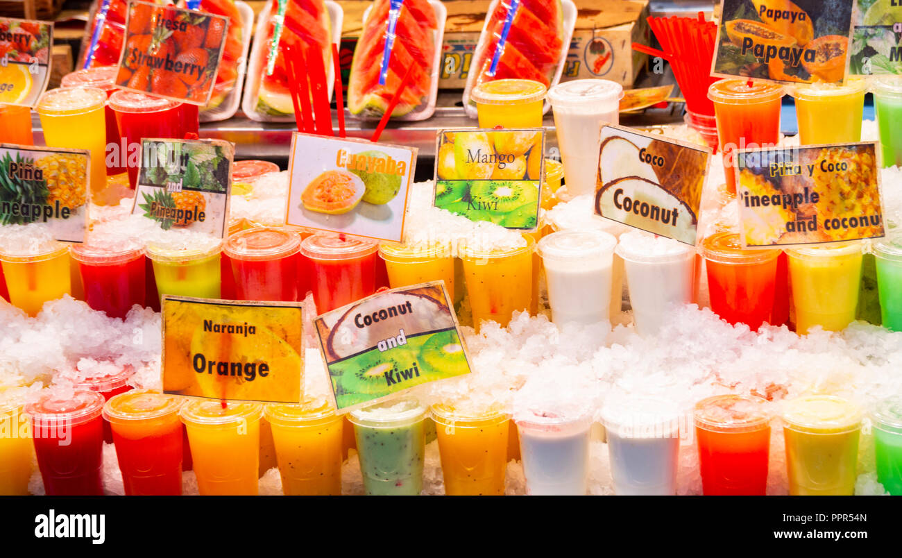 Fresh fruit juices and smoothies in La Boqueria market just of Las Ramblas  in Barcelona, Spain Stock Photo - Alamy