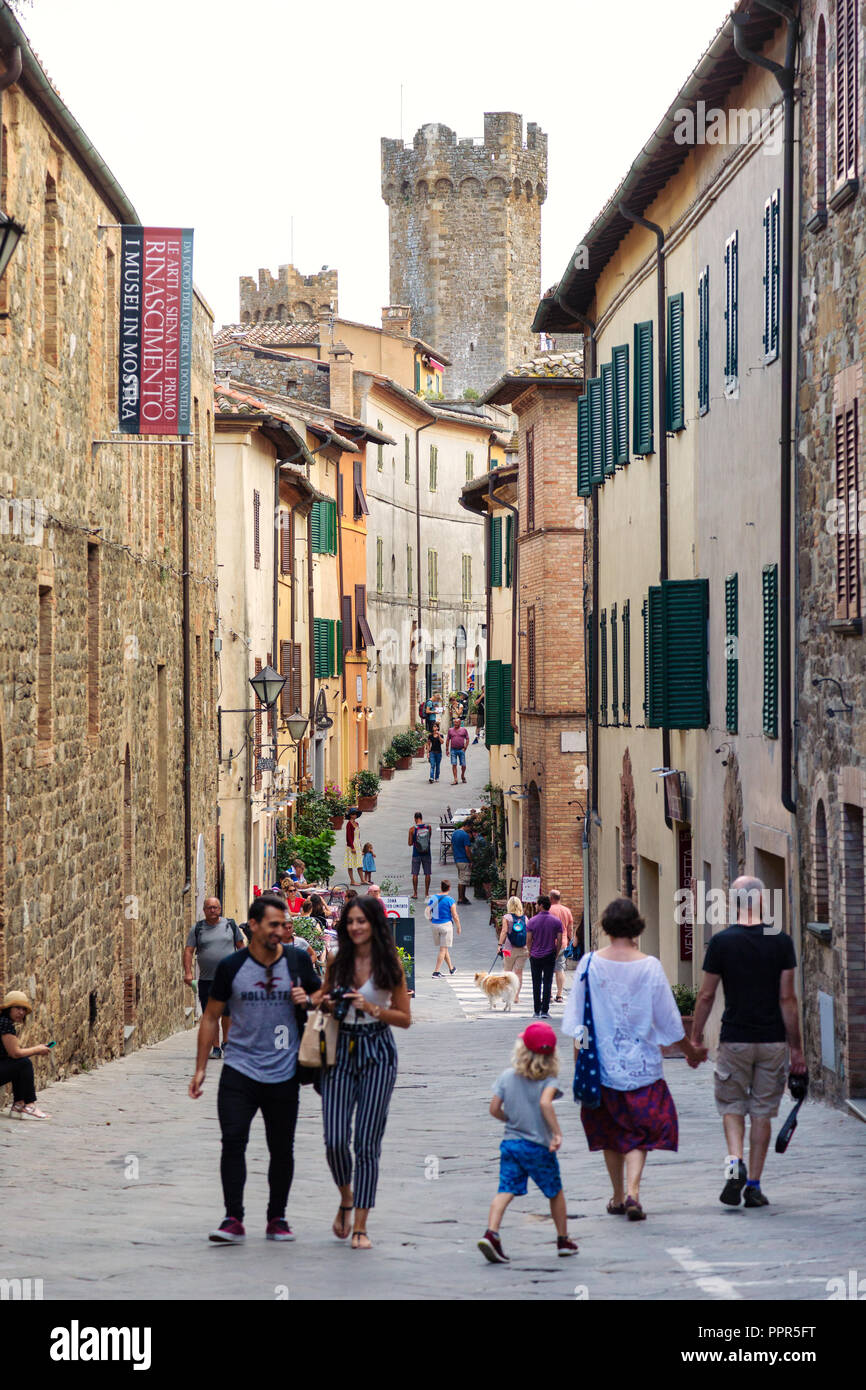 Montalcino Italy, local people and tourists in the Via Ricosoli street and the fortress; the medieval town of Montalcino Tuscany Italy Europe Stock Photo