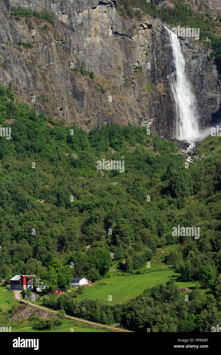Farm & waterfall, Lustrafjorden, Sogn og Fjordane County, Norway Stock Photo