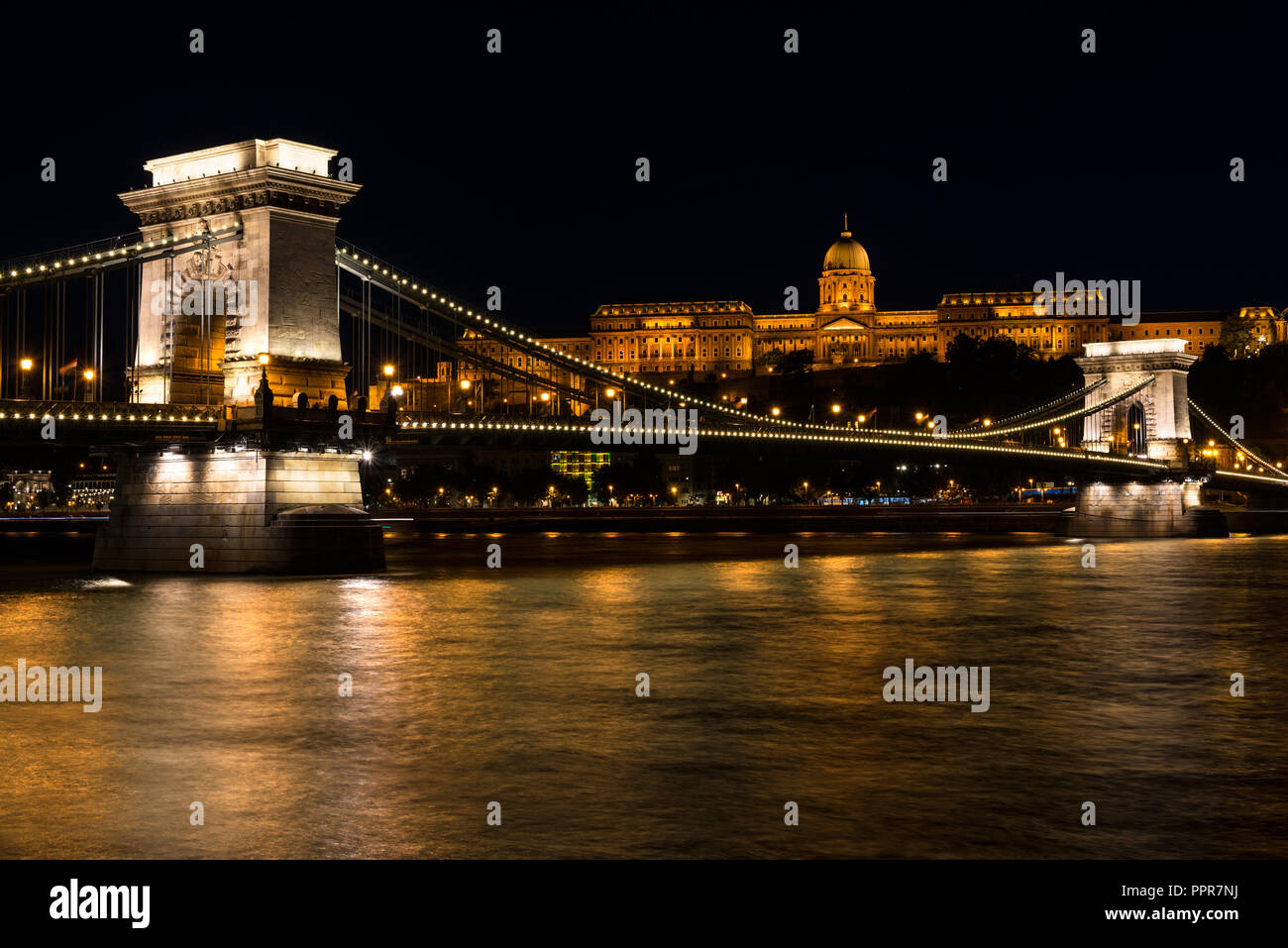 Night view of some of the most famous Hungarian landmarks, including the Széchenyi Chain Bridge and the Royal Palace as seen from the other side of th Stock Photo