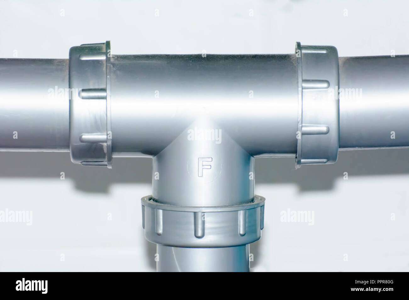 Water pipe under a kitchen sink Stock Photo Alamy