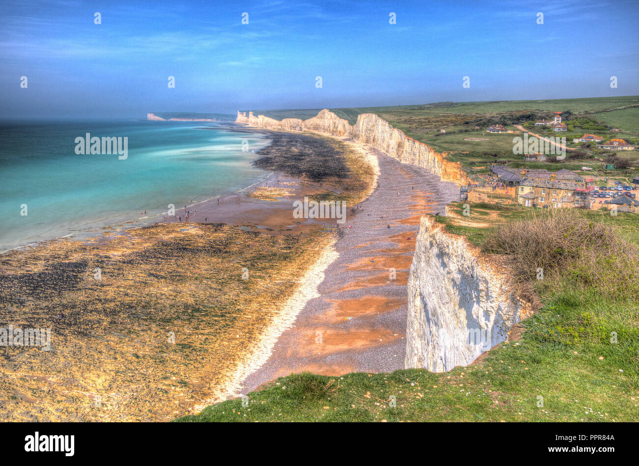 Birling gap beach near Seven Sisters chalk cliffs and Beachy head East Sussex UK in colourful hdr Stock Photo