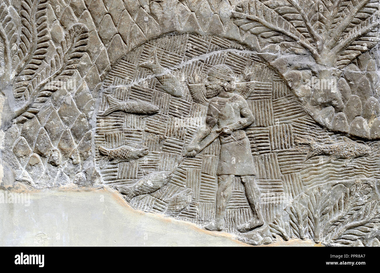 Assyrian stone panel (Nineveh: 700-692BC) showing a fisherman. British Museum, Bloomsbury, London, England, UK. Stock Photo