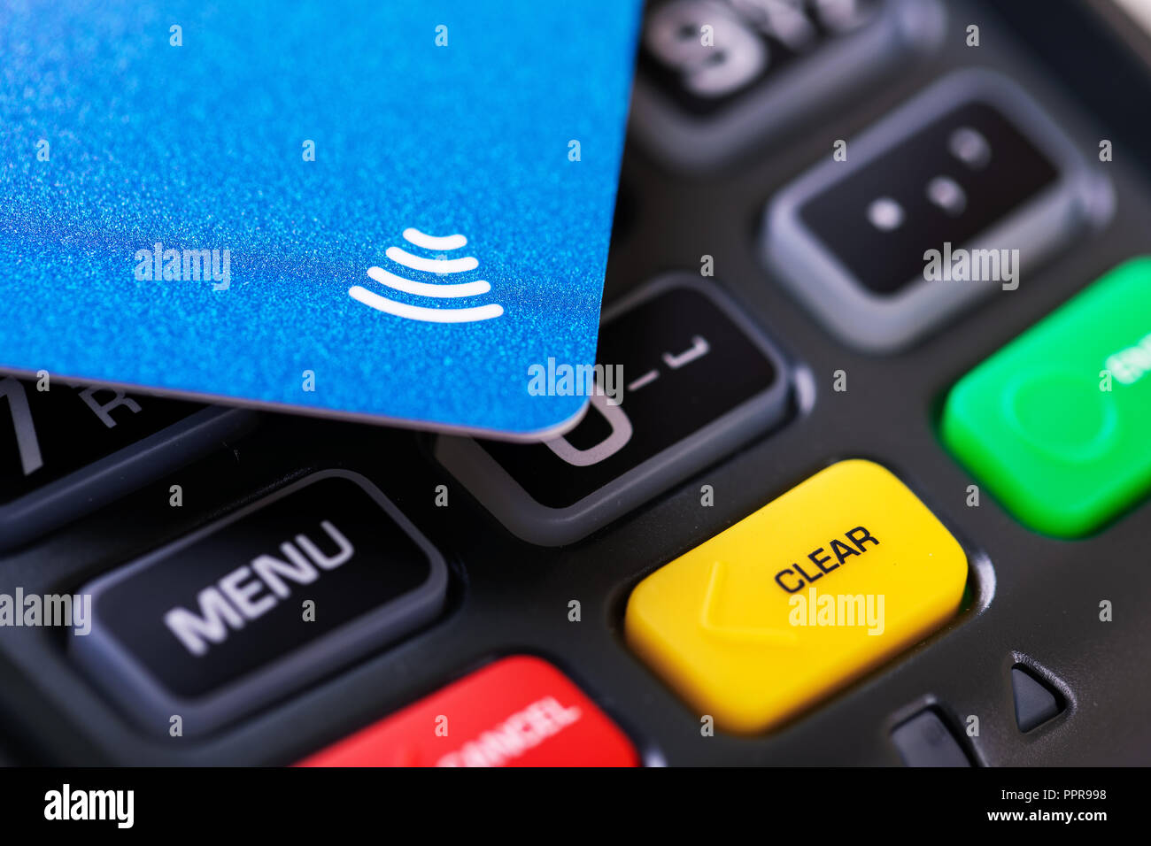 contactless payment - nfc credit card on transaction terminal Stock Photo