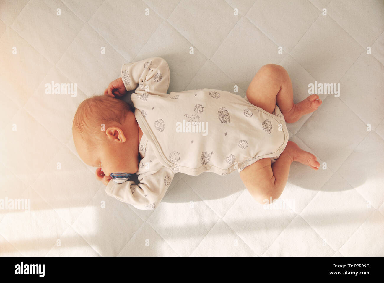 newborn baby boy sleeping in a cot. top view Stock Photo