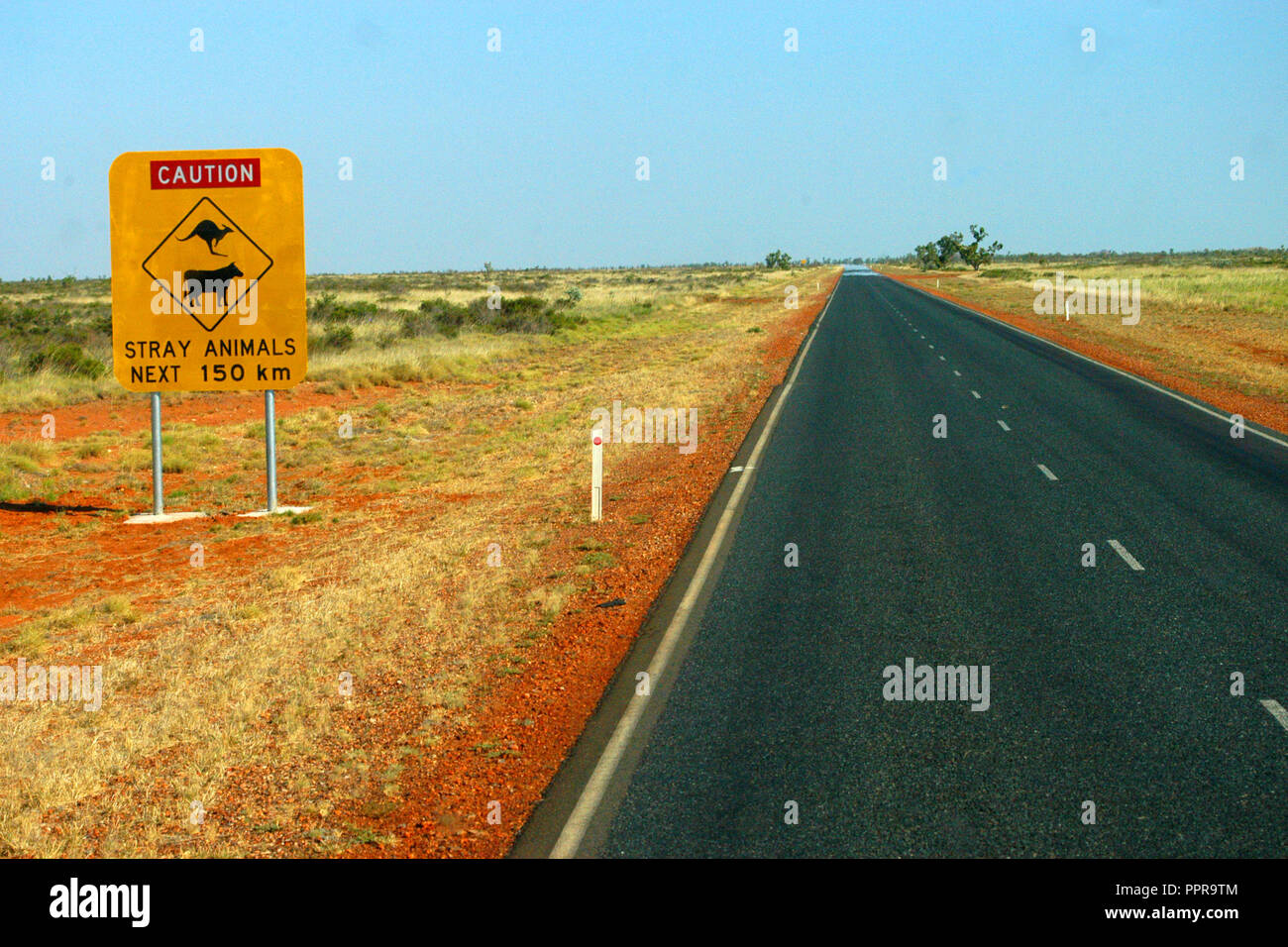 Caution stray animals for next 150 km, road sign on an outback road, Western Australia. Stock Photo