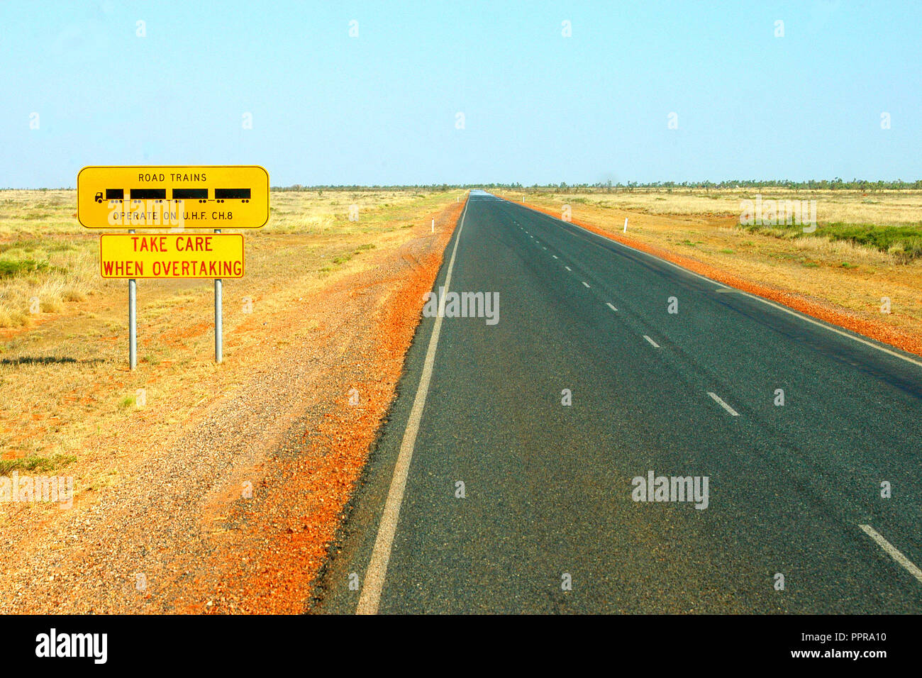 ROAD TRAIN SIGN, TAKE CARE WHEN OVERTAKING, OUTBACK HIGHWAY, WESTERN AUSTRALIA Stock Photo