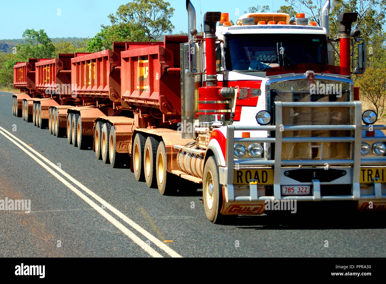 TRAY ROAD TRAIN ON OUTBACK ROAD IN WESTERN AUSTRALIA Stock Photo Alamy