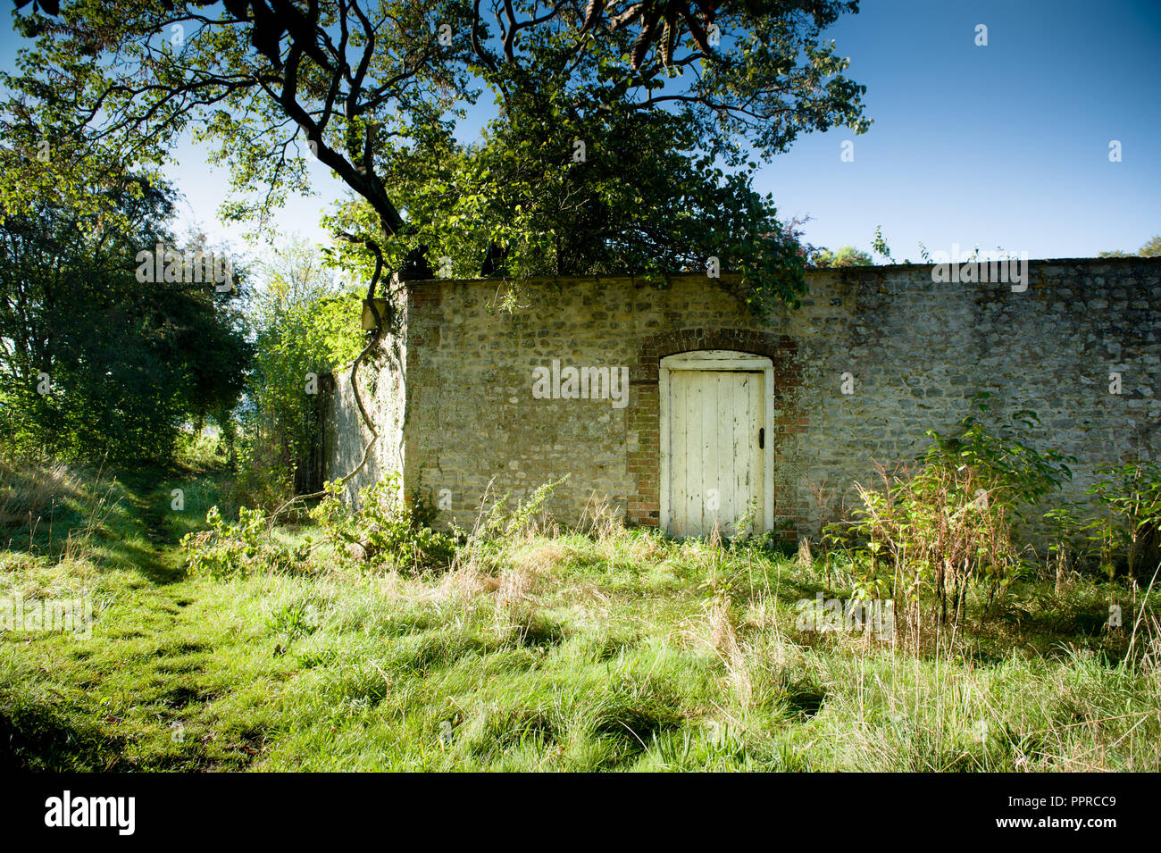 Old brick garden boundary wall hi-res stock photography and images - Alamy