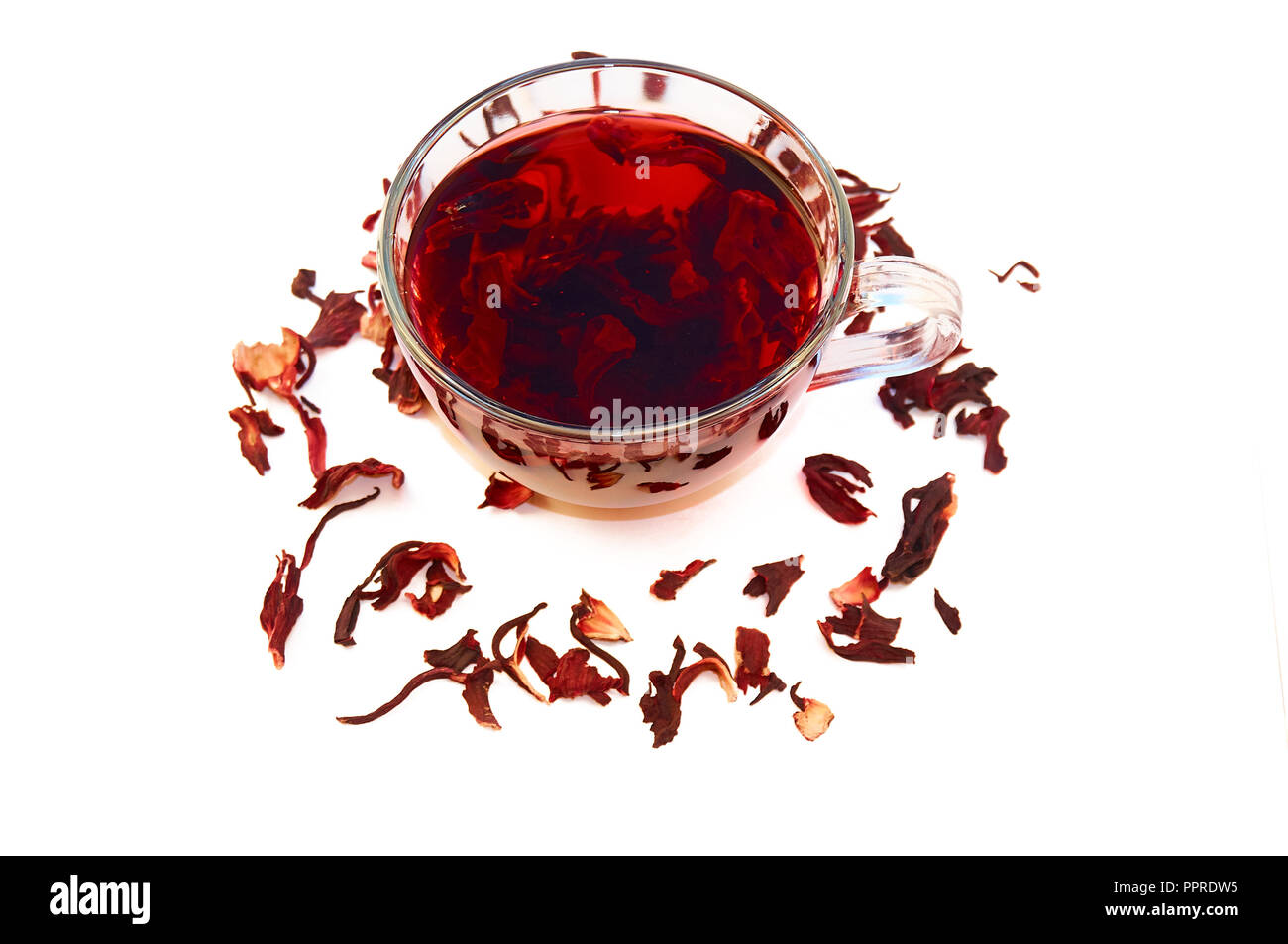 Hibiscus tea in a glass cup on a white background. Stock Photo