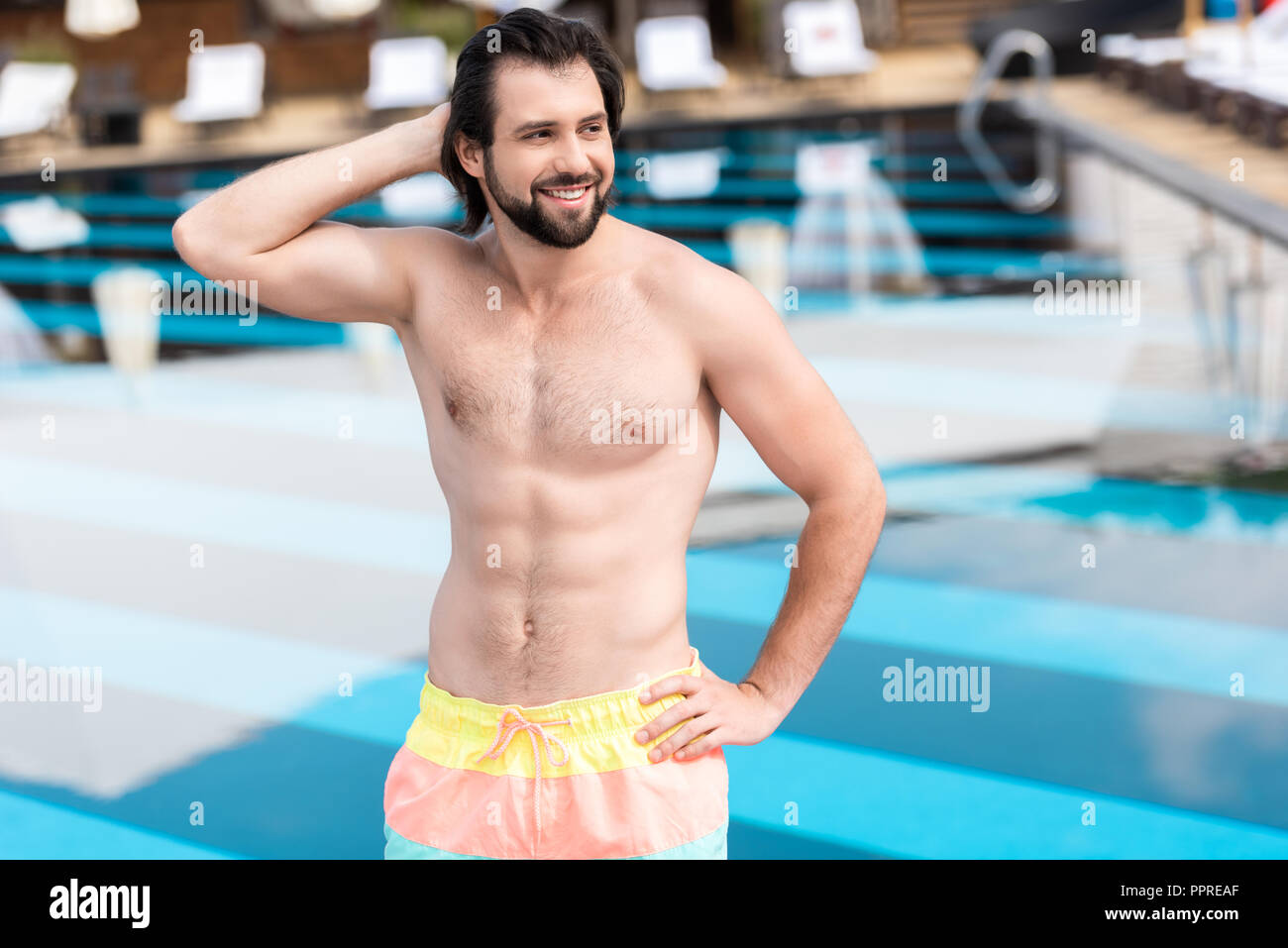 Boy swimmer with smile on bearded face in swimming pool Stock Photo by  ©Tverdohlib.com 161922302