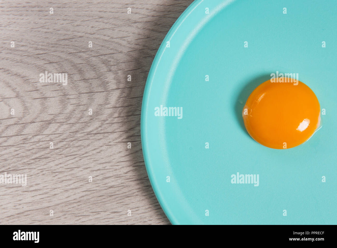 egg yolk on plate Stock Photo Alamy