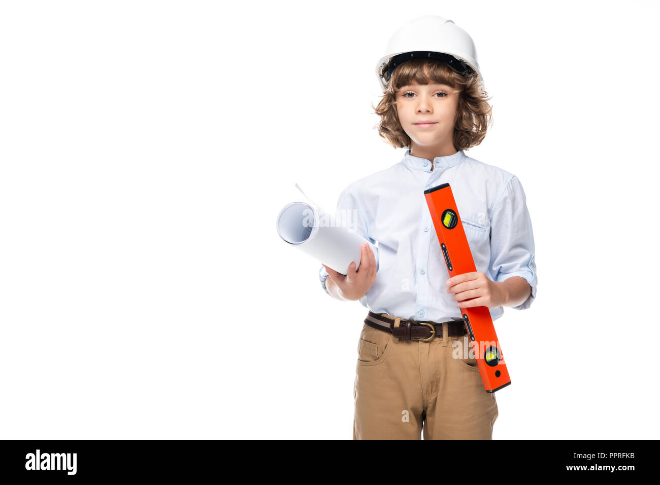 schoolboy in costume of architect and helmet holding blueprints and spirit  level isolated on white Stock Photo - Alamy