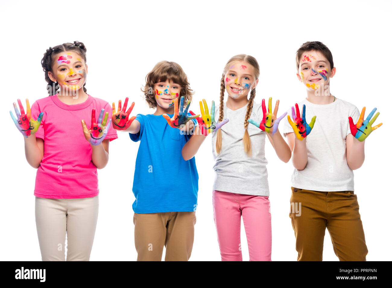 schoolchildren showing painted hands with smiley icons isolated on white Stock Photo
