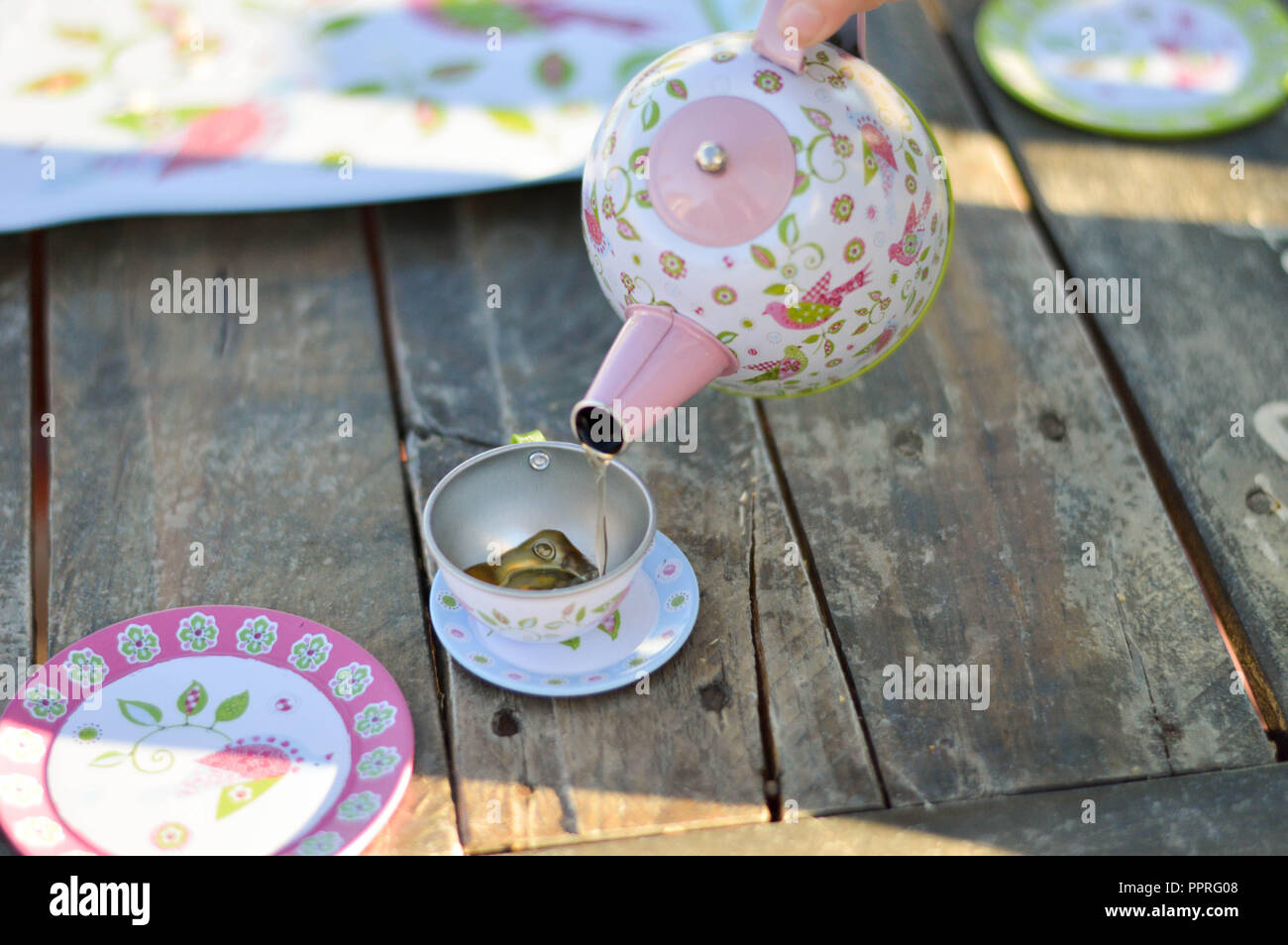 Girl tea pot hi-res stock photography and images - Alamy