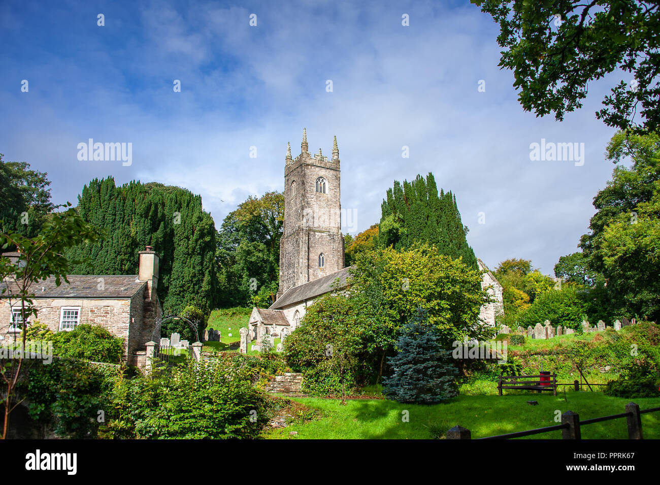Picturesque Church of St Nonna, or Cathedral on the Moor at Altarnun, near Bodmin, Cornwall. Beautiful Norman building, in a green, grassy churchyard Stock Photo