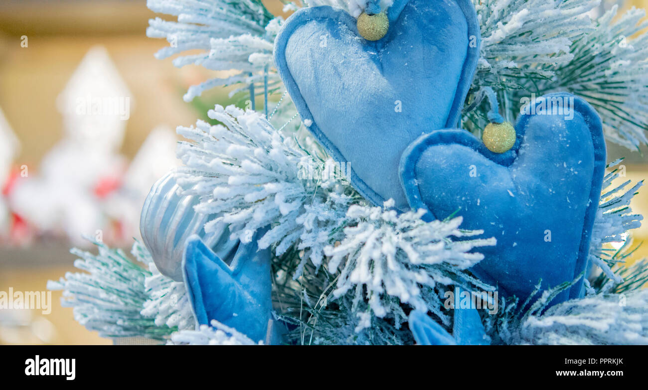 https://c8.alamy.com/comp/PPRKJK/decorative-snow-covered-christmas-tree-decorated-with-decorative-christmas-tree-toys-blue-hearts-from-fabric-decorations-christmas-winter-new-year-background-PPRKJK.jpg