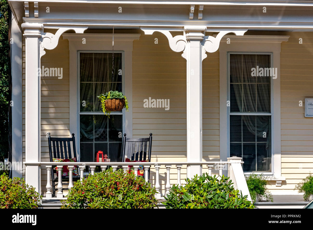 A table and chairs on the front porch of a colonial house in Newport Rhode Island  Island ,USA Stock Photo