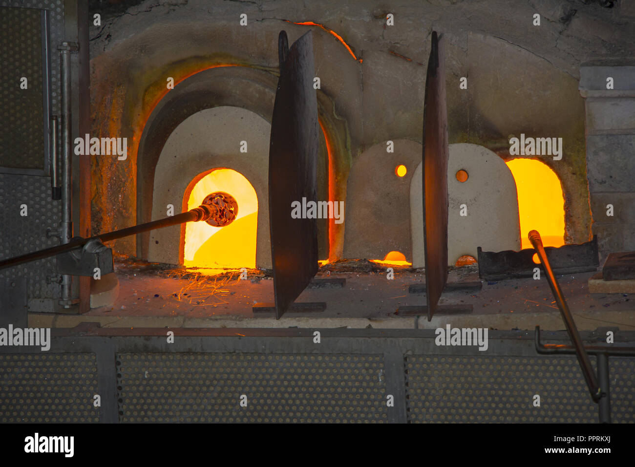 Manufacturing glass in a traditional oven, in glass factory in Murano