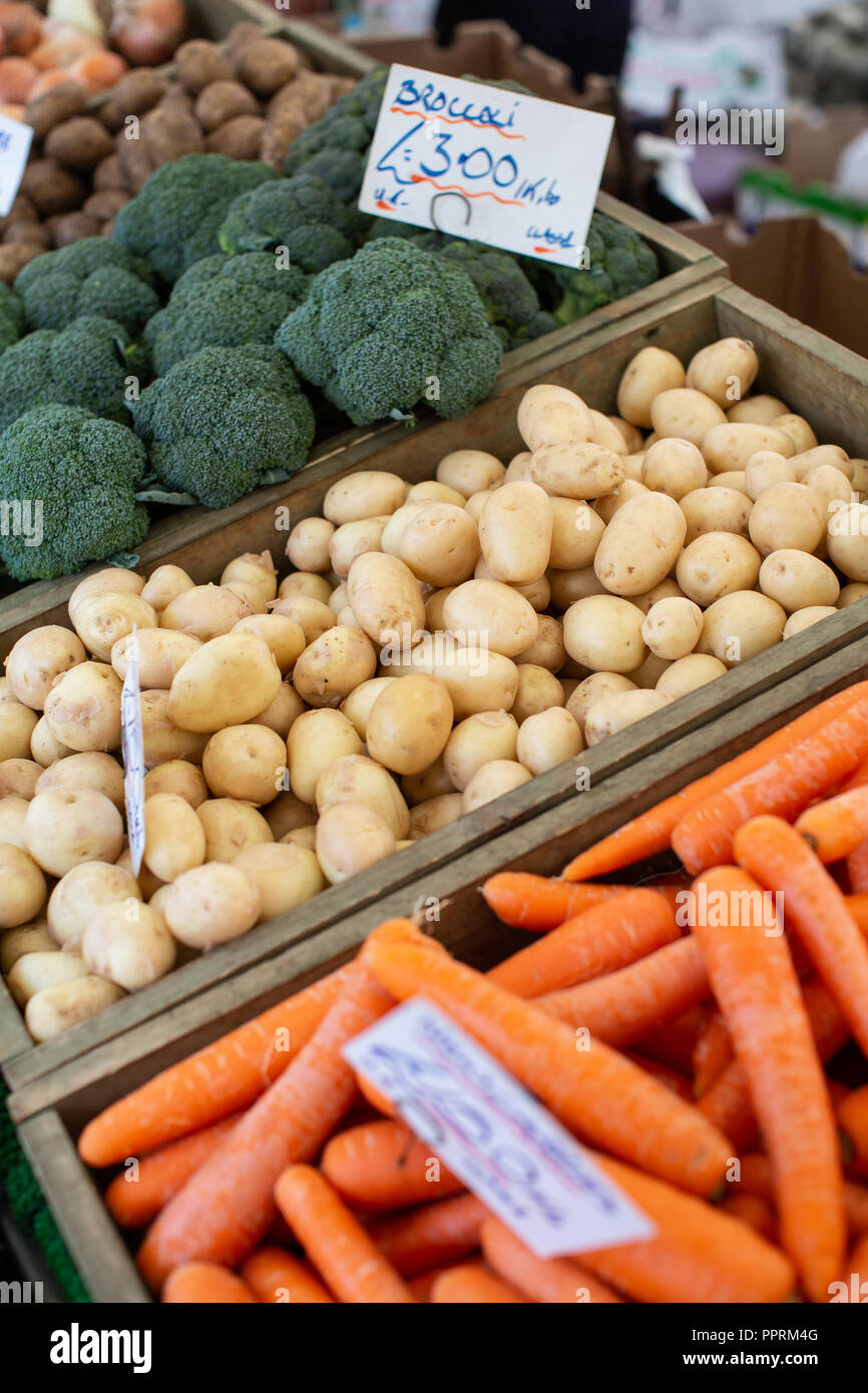 Fruit and vegetable stall holder on a market in Yorkshire . This type