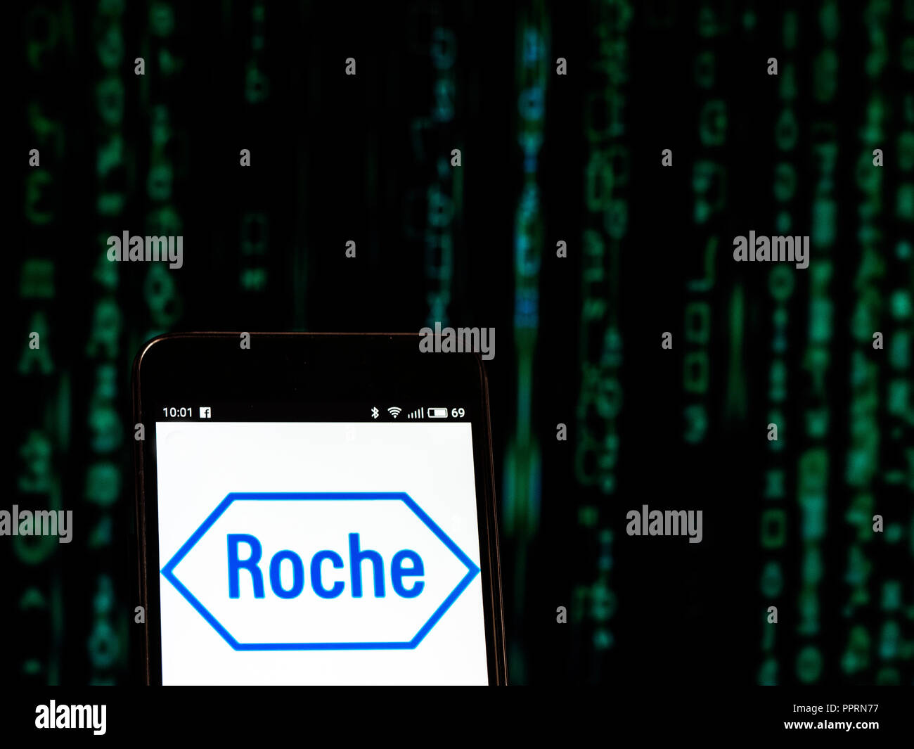 Hoffmann-La Roche logo seen displayed on smart phone. F. Hoffmann-La Roche AG is a Swiss multinational healthcare company  that operates worldwide under two divisions: Pharmaceuticals and Diagnostics. Stock Photo