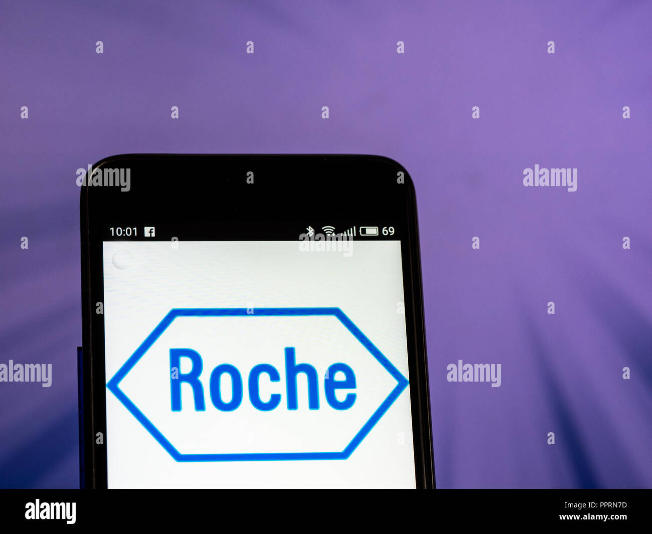 Hoffmann-La Roche logo seen displayed on smart phone. F. Hoffmann-La Roche AG is a Swiss multinational healthcare company  that operates worldwide under two divisions: Pharmaceuticals and Diagnostics. Stock Photo