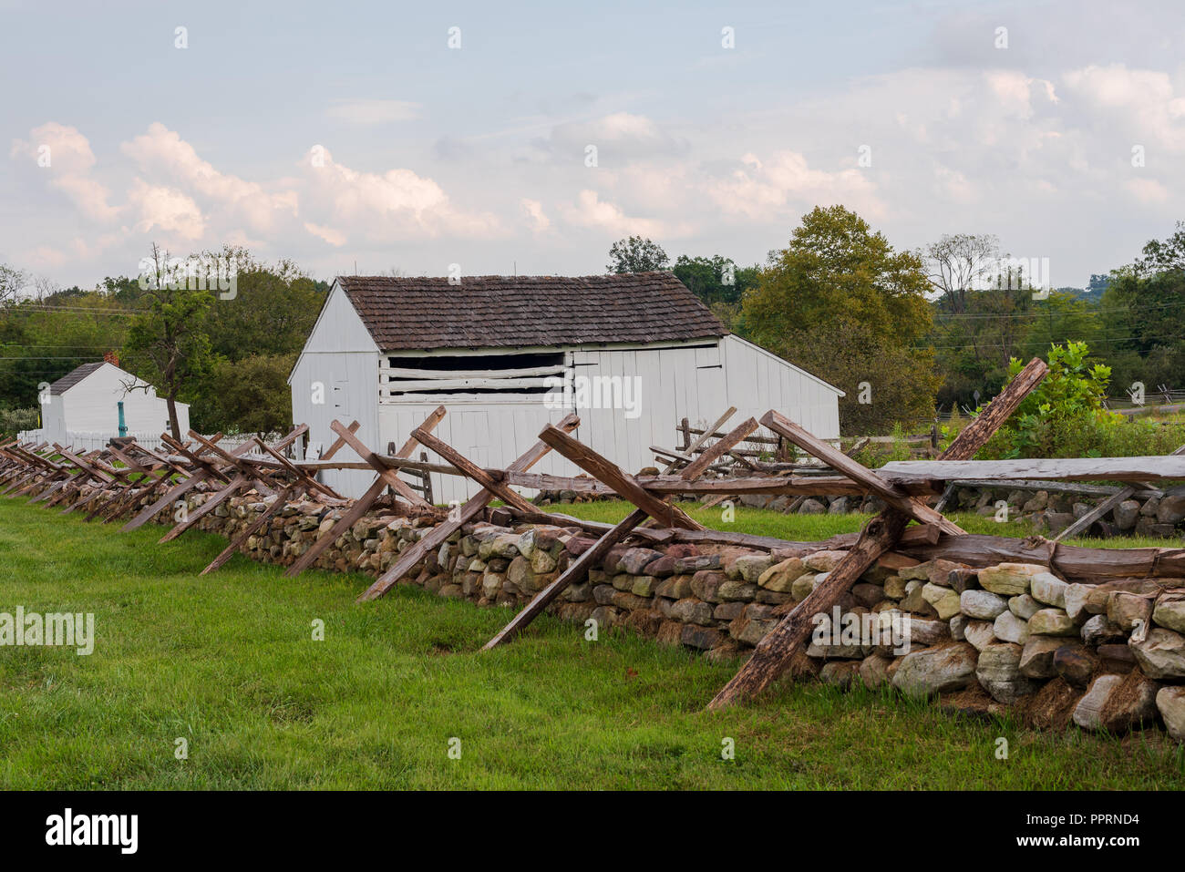 Wooden fences establish a defensive barrier against attacking armies. Stock Photo