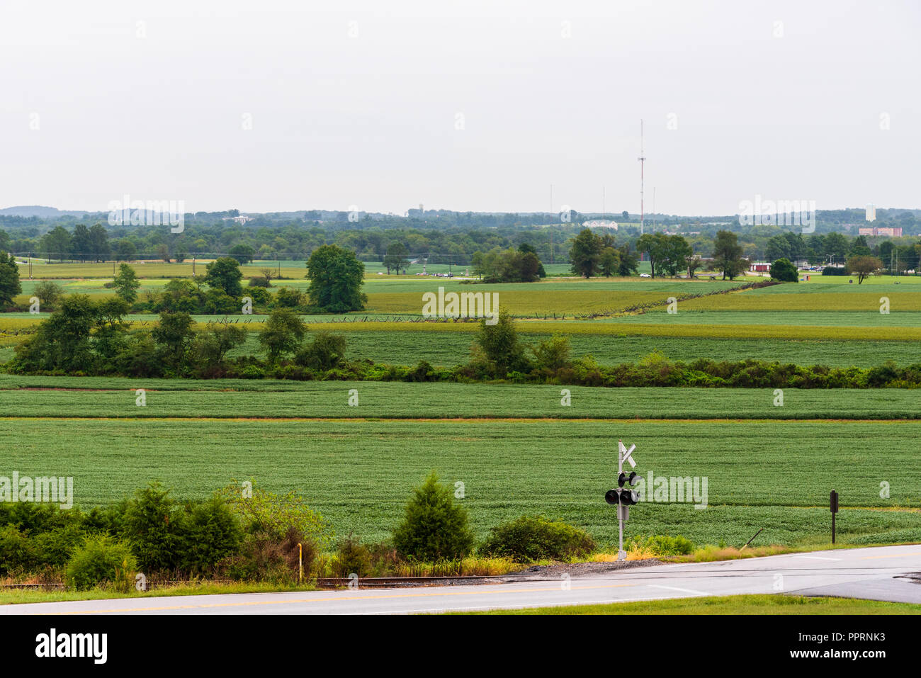 Swaths of farmland by a train crossing in the historic town of Gettysburg, PA. Stock Photo