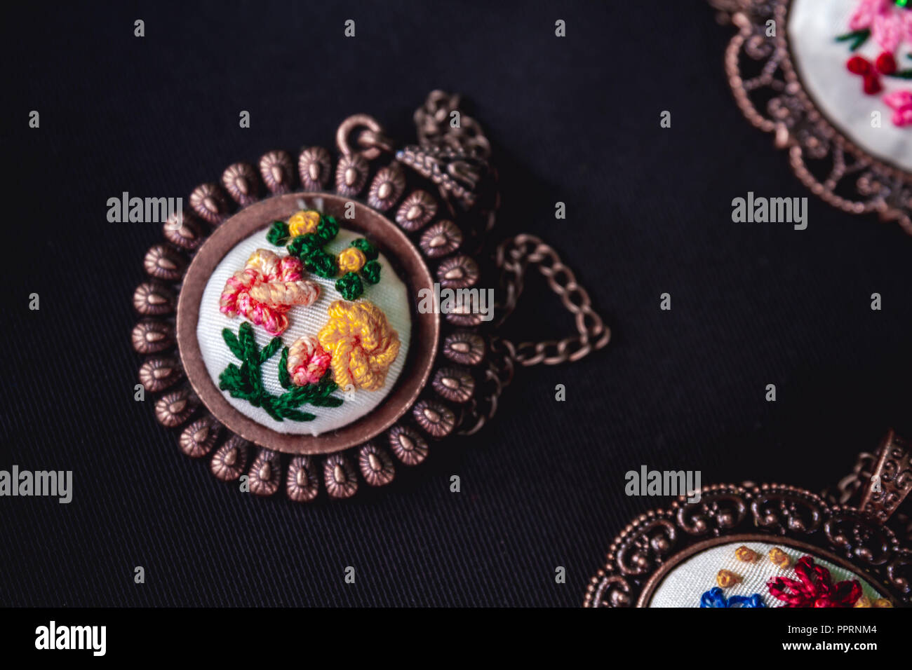 Turkish handmade copper necklaces on dark background Stock Photo