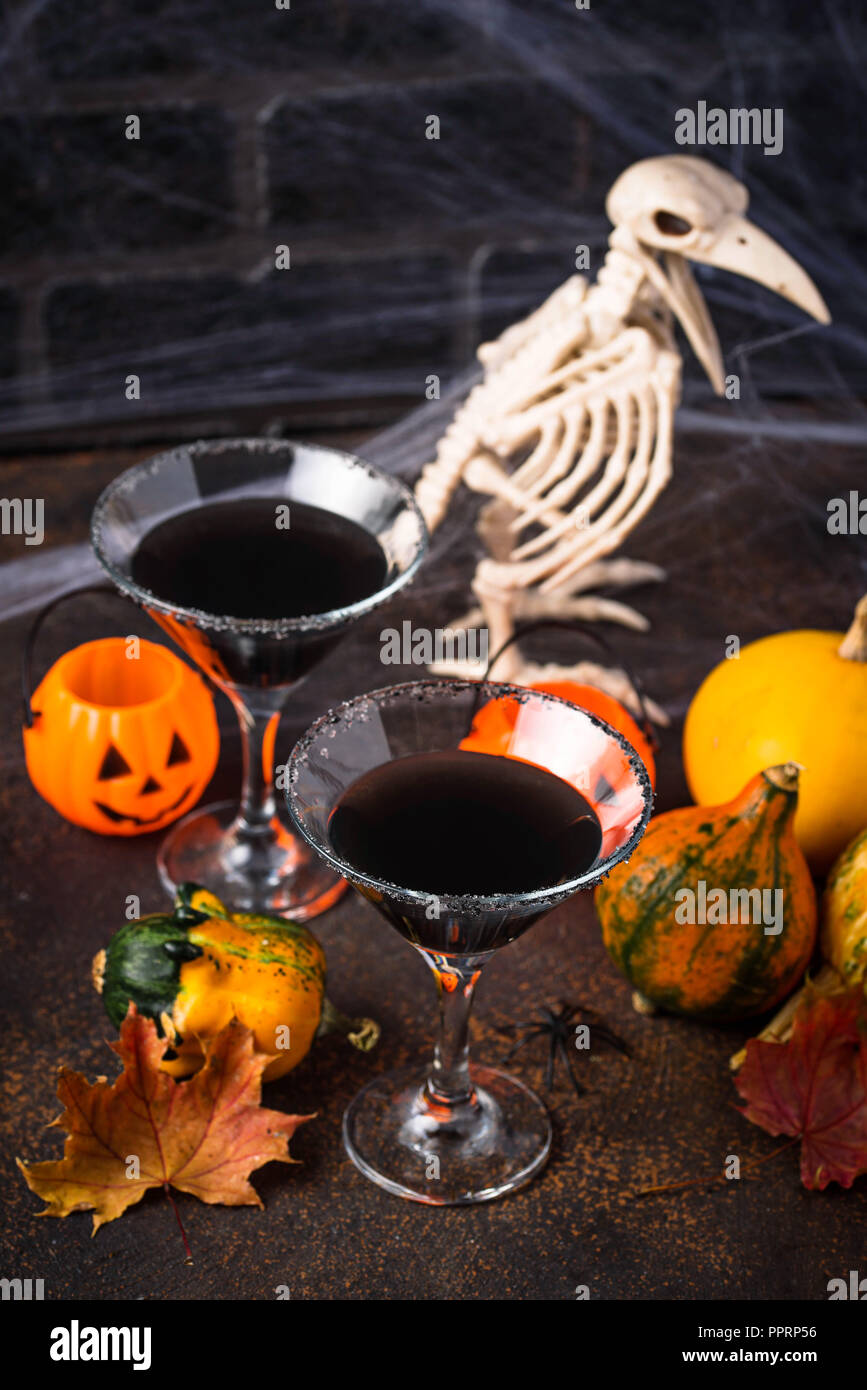 Halloweens spooky drink black martini cocktail Stock Photo Alamy
