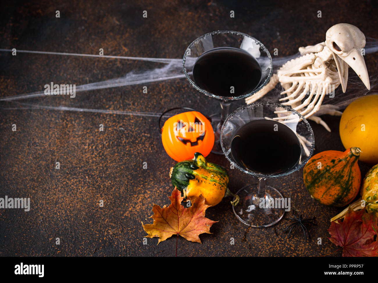 Halloweens spooky drink black martini cocktail Stock Photo Alamy