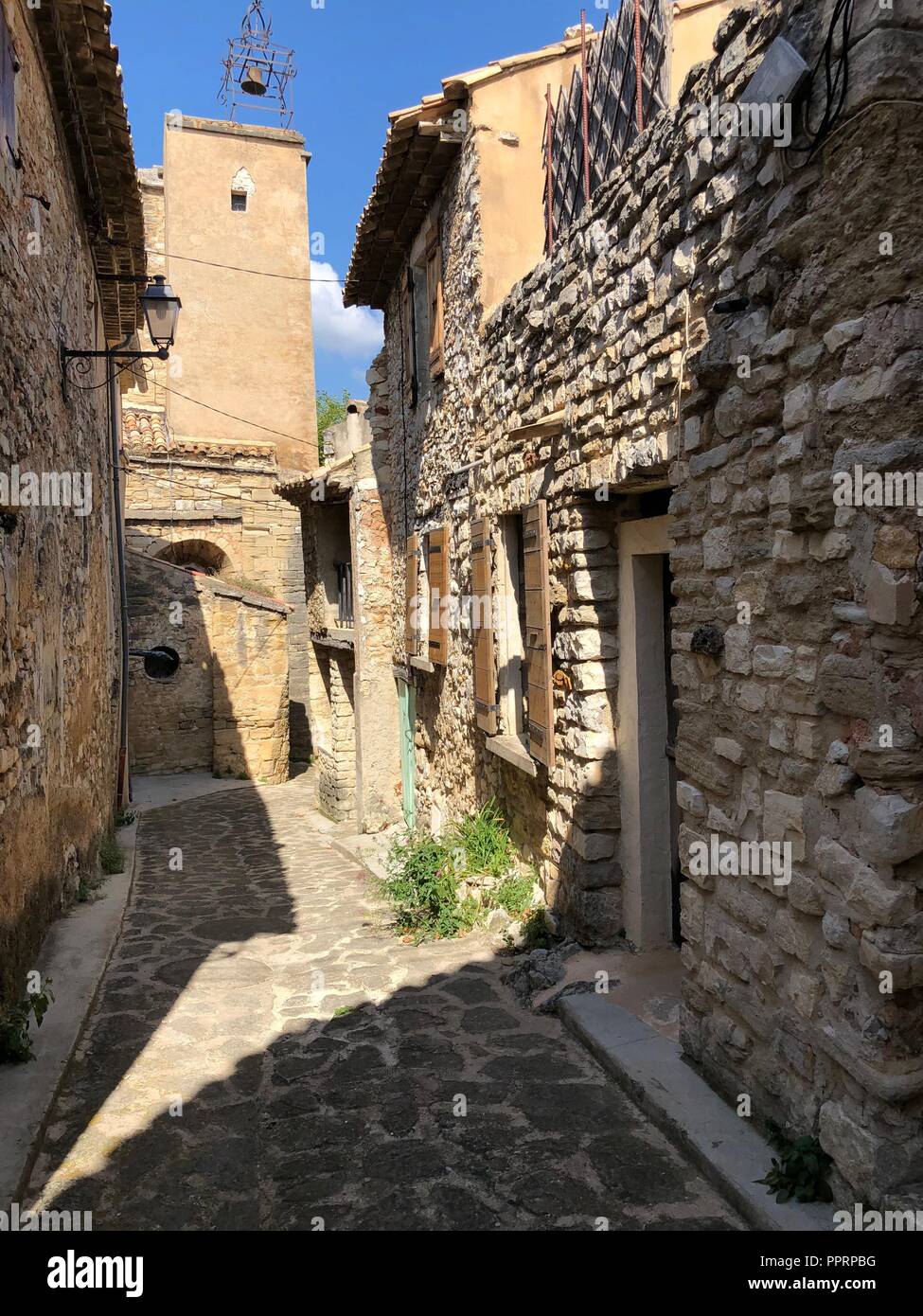 Traditional buildings and street in Provençal town in summer Stock Photo