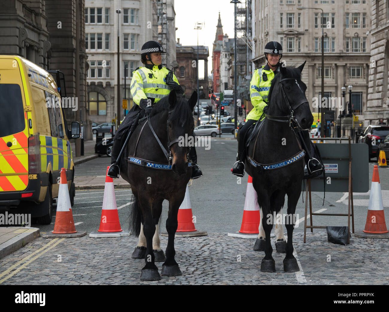 Two female mounted British police officers on duty in Liverpool UK. Stock Photo