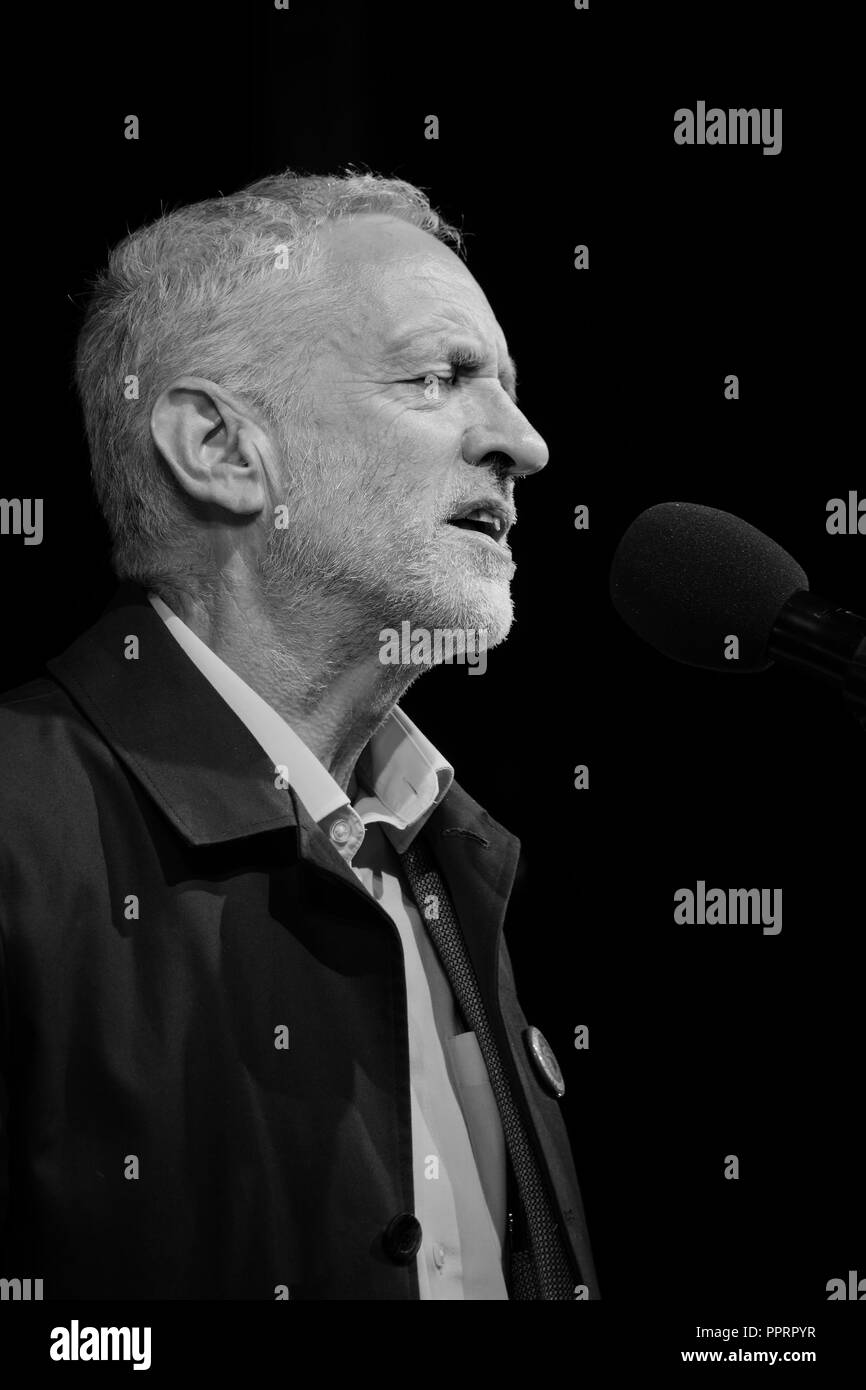 Monochrome side view portrait image of Labour leader Jeremy Corbyn giving a speech on stage at the pre conference rally in Liverpool 2018. Stock Photo
