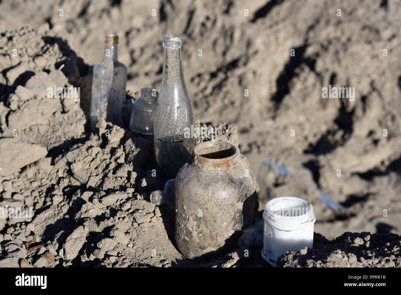 Antique bottles found in excavation pit Stock Photo
