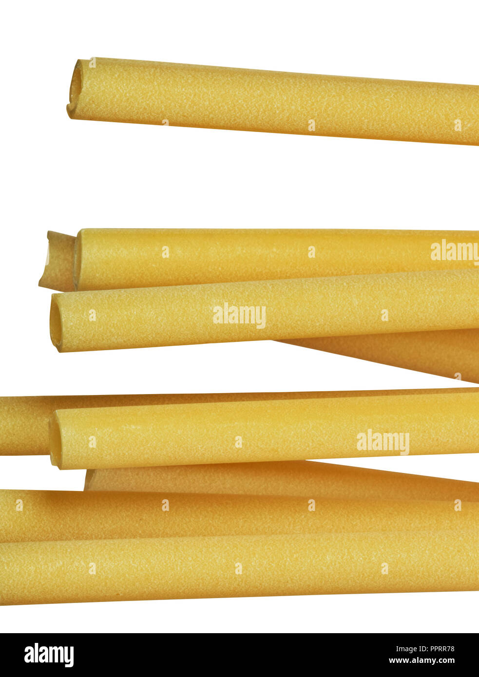 A group of Italian pasta called ziti on a white background ,long empty