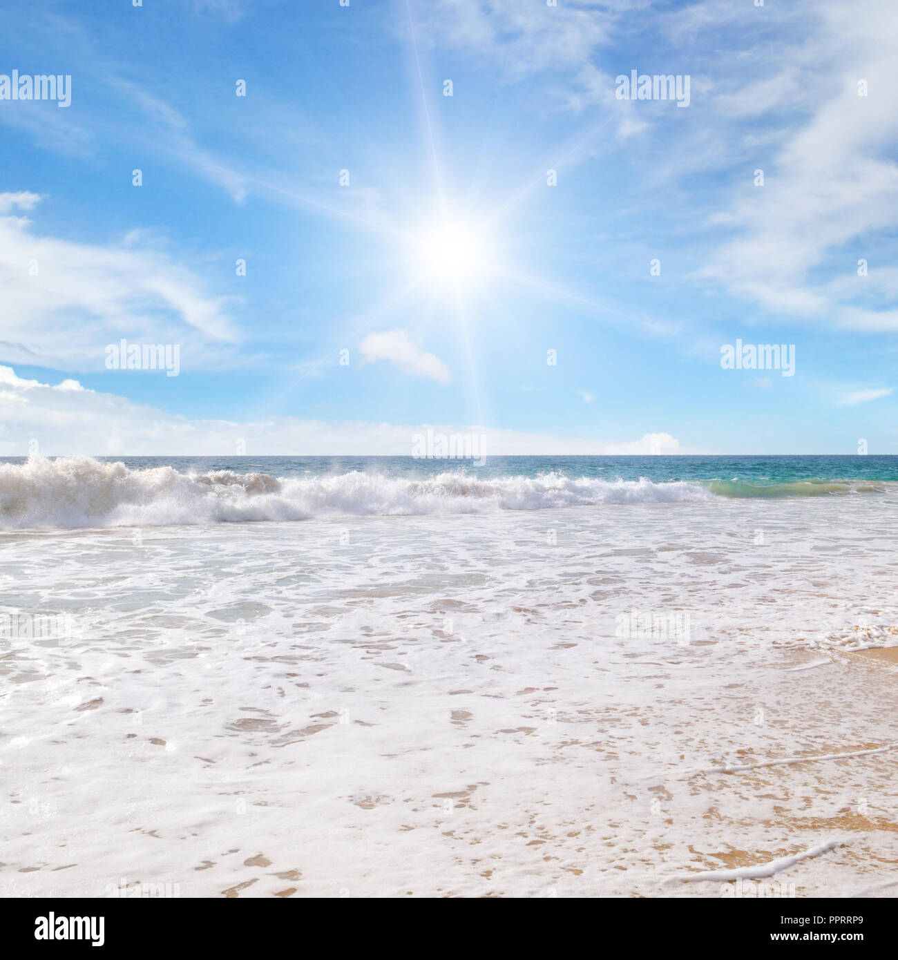 ocean, sandy beach and blue sky Stock Photo - Alamy