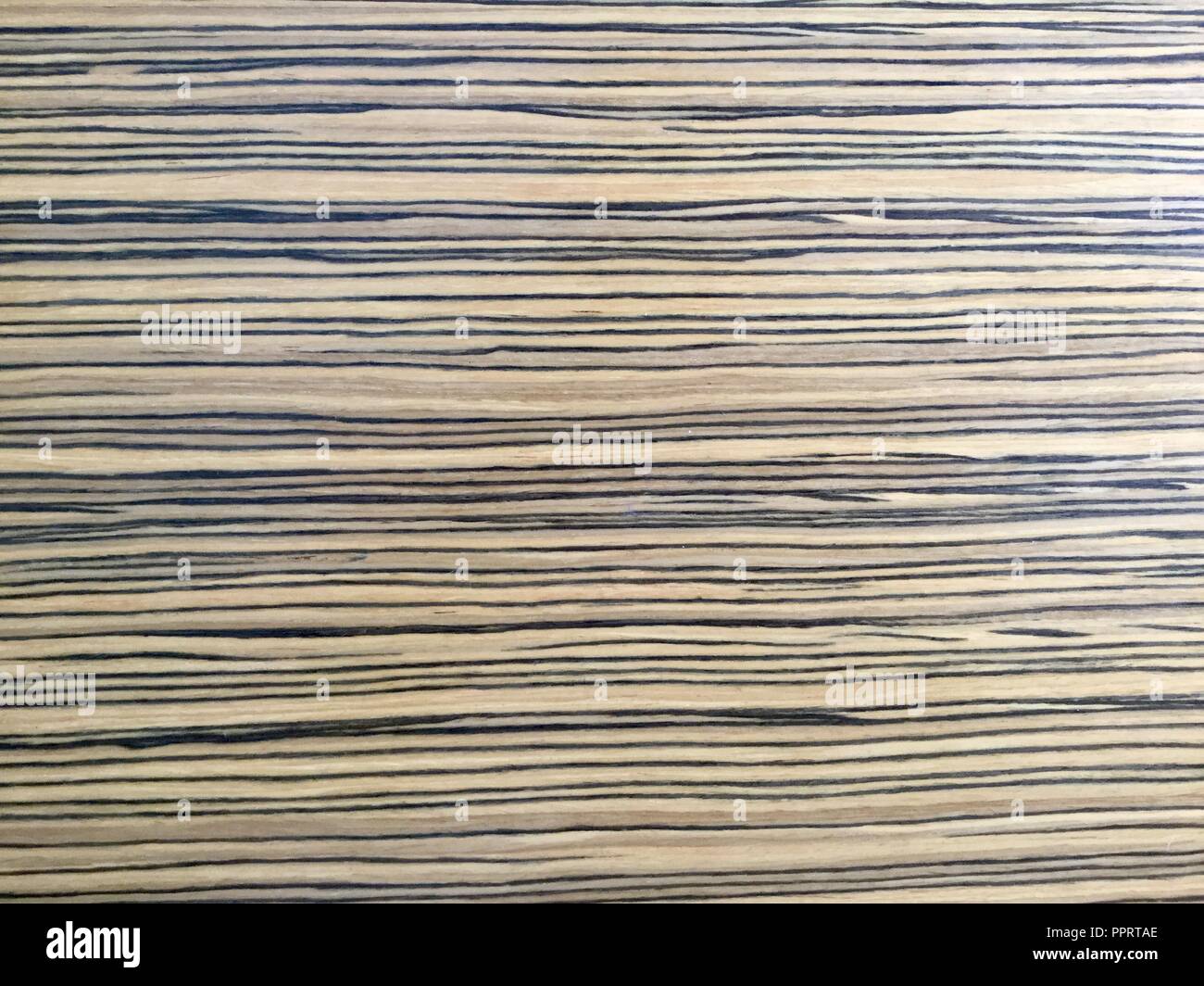 Light wood with dark grain background, smooth surface. Stock Photo